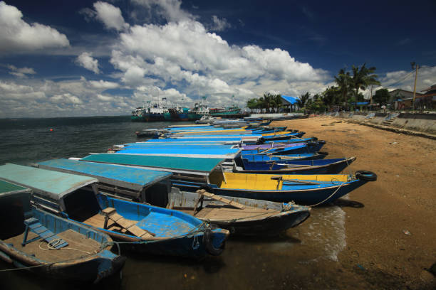istock Row of resting boats on a harbour 1392978052