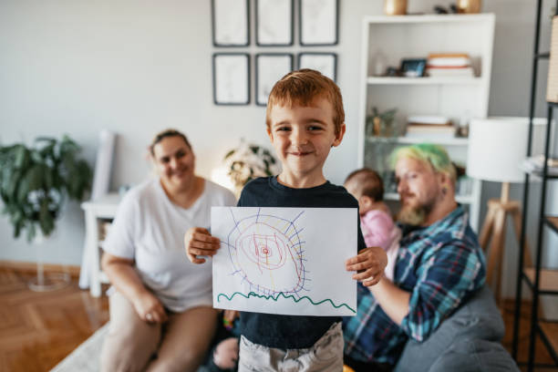 istock Millennial parents playing with five year old son at home 1392980885