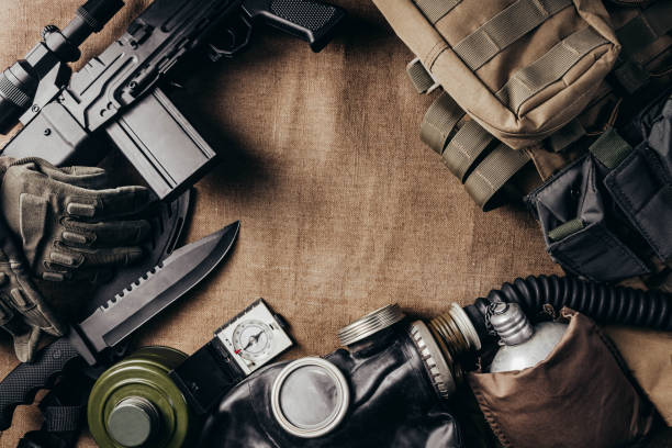 Stalker soldier ammunition laying on table. Photo of post apocalyptic stalker soldier ammunition laying on table upper view. knife weapon stock pictures, royalty-free photos & images