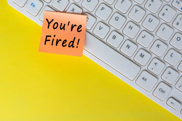 istock You're Fired text on orange sticky note on top of white keyboard. 1392985638