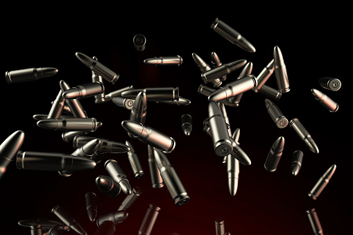 3d render illustration of metal bullets flying on dark red background close-up view.