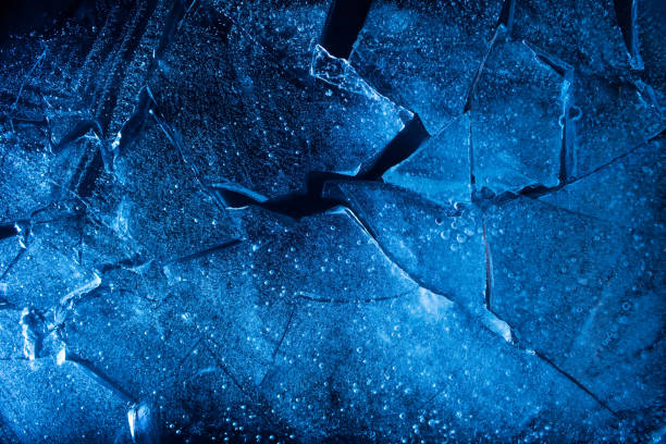 Texture of a blue toned frozen ice cubes. stock photo