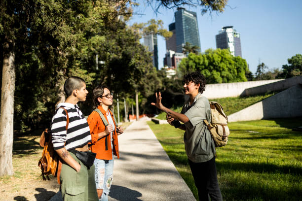 istock Three young women standing in park 1392992024