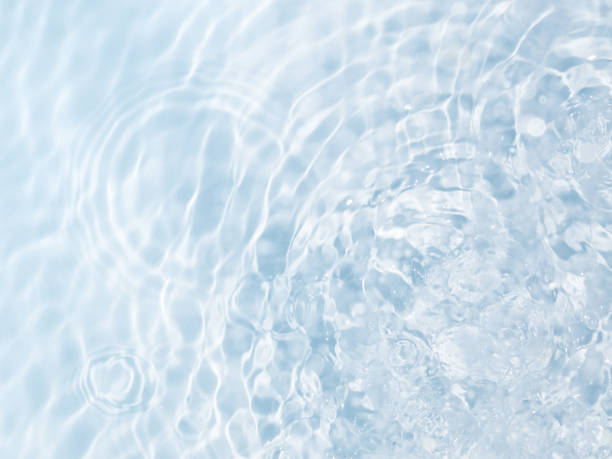istock Blue water background with circles from drops and ripples 1392992075