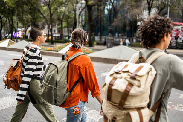 istock Three young women walking around the city 1392992148