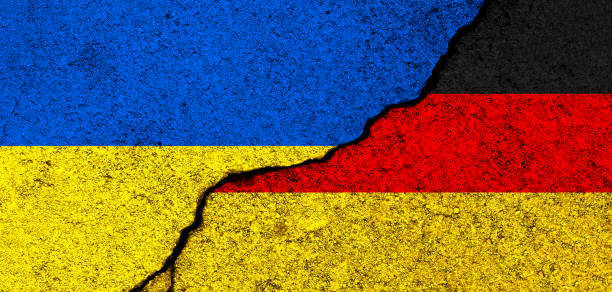 istock Ukraine and Germany flags. Support and help, weapons and military equipment, partnership and diplomacy, humanitarian aid and donations for Ukrainian refugees 1392992215