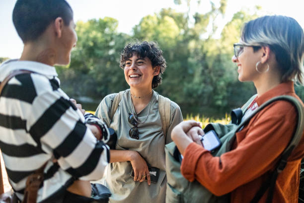 istock Friends standing and talking what to visit next 1392992271
