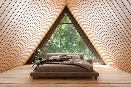 Wooden Tiny House Interior With Bed Furniture And Triangular Window.