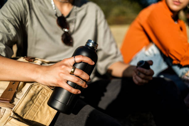 Close up on woman hand holding reusable bottle