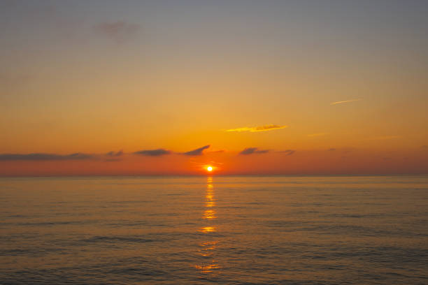 istock Dramatic dawn sky with clouds. Dramatic sunset over the sea. 1392995887