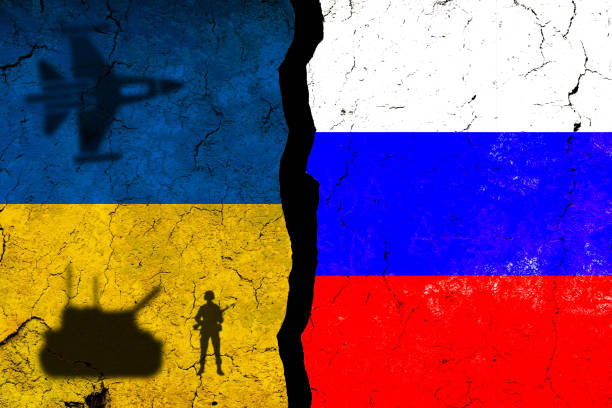 istock Ukraine and Russia flags on cracked wall. 1392996167