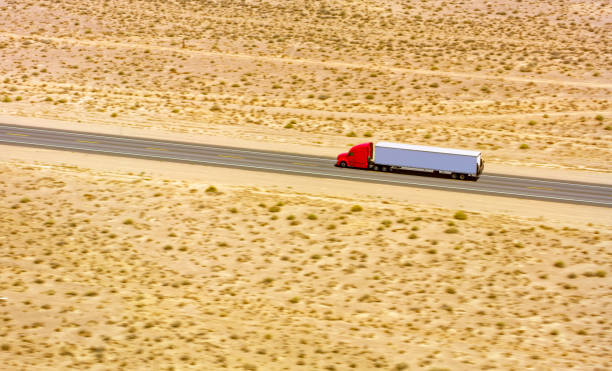 istock Truck driving on a highway 1393000533