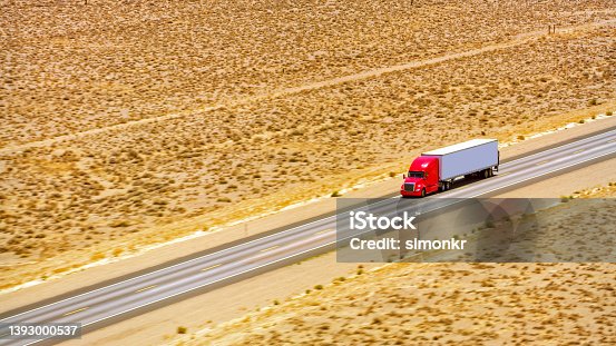 istock Truck driving on a highway 1393000537