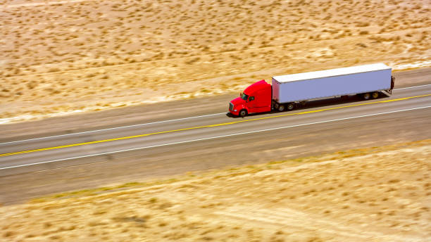 istock Truck driving on a highway 1393000540