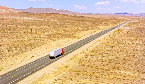 istock Truck driving on a highway 1393000550