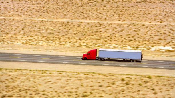 istock Truck driving on a highway 1393000551