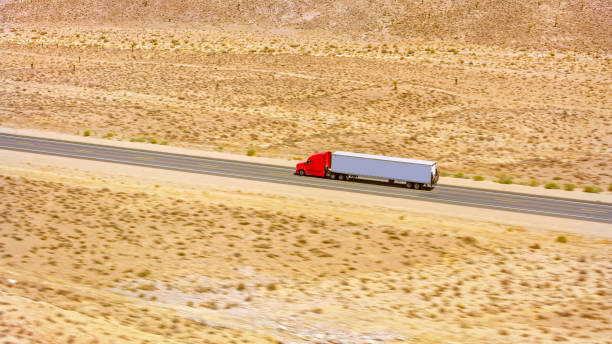 istock Truck driving on a highway 1393000554