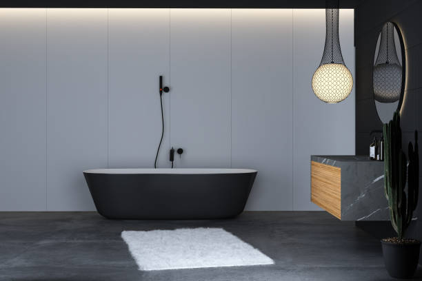 istock Modern bathroom interior with concrete floor, black bathtub 1393003999