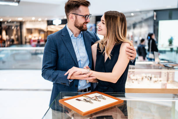 istock Beautiful couple in jewelry store 1393005665