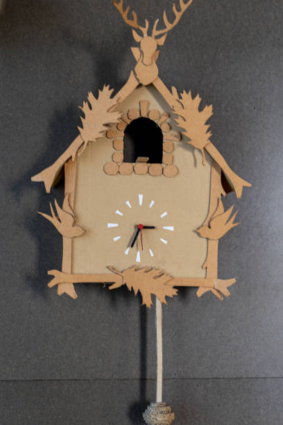 istock wall clock with pendulum and manual ornamentation built in cardboard 1393005985