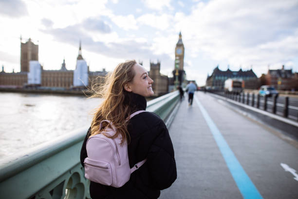 istock Woman having fun on Westminster Bridge 1393006819