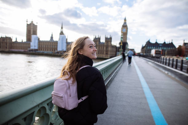 istock Woman having fun on Westminster Bridge 1393006863