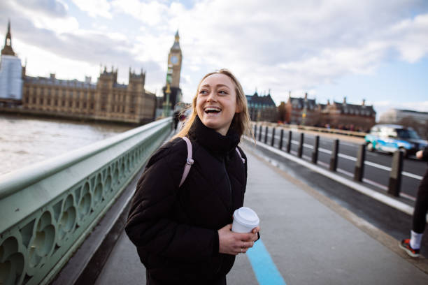 istock Woman having fun on Westminster Bridge 1393006876