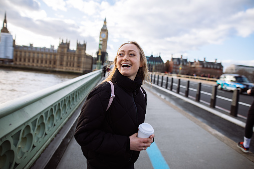Woman having fun on Westminster Bridge