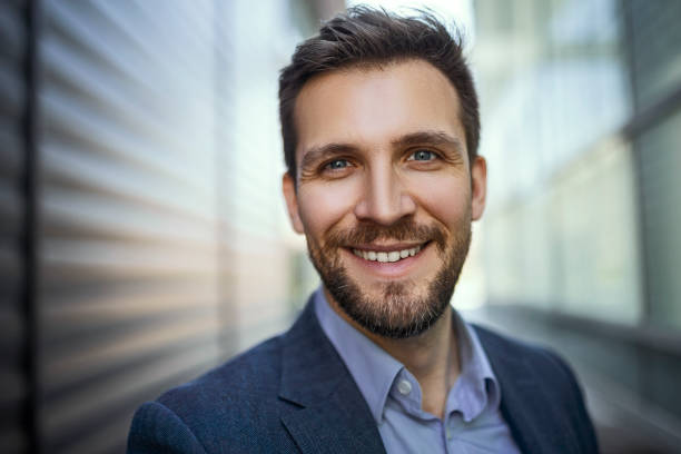istock Young businessman looking at camera 1393006890