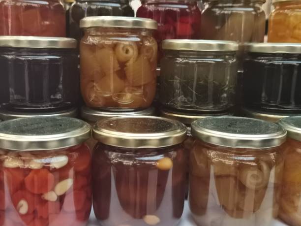 istock Preserves in small jars filled and sealed 1393013668
