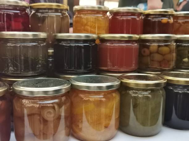 istock Preserves in small jars filled and sealed 1393014347