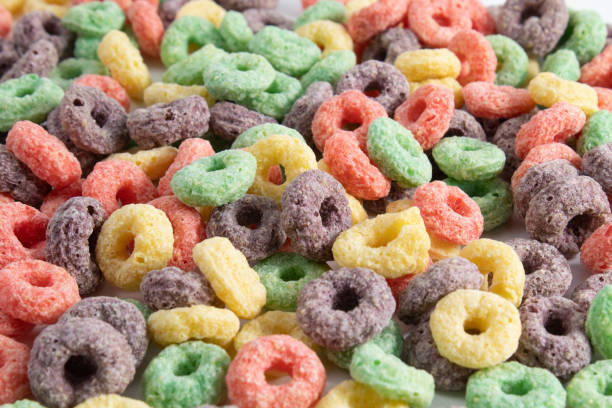 istock Multicolored breakfast cereal texture. Healthy and tasty fruit flavored cereal 1393014943