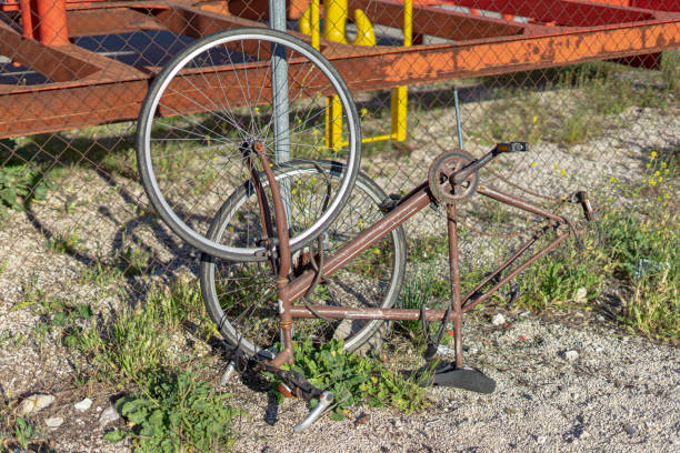 istock degraded bicycle leaning against a railing on the public road 1393016293
