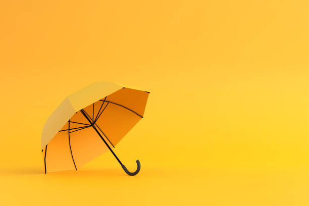 istock Yellow umbrella on a yellow background 1393016881