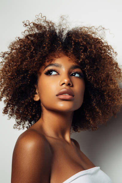 istock Beautiful afro girl with curly hairstyle 1393020780