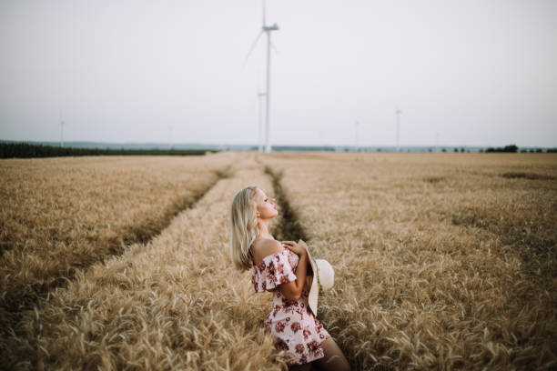 istock young woman in wheat field 1393022406
