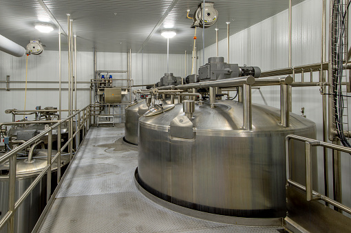 Milk pasteurizer in a commercial dairy.machinery