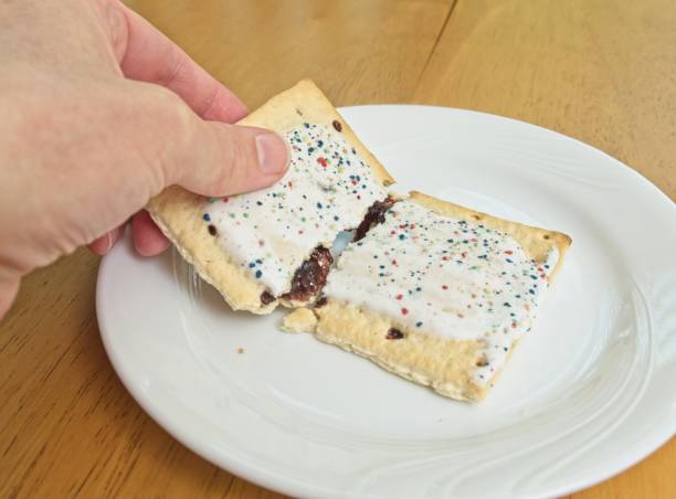 istock A sweet toaster pastry treat being split open with a human hand on a white plate 1393027962