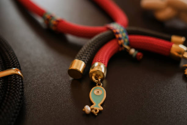 istock Beautiful hand made necklaces made with rope, with fish symbol 1393032042