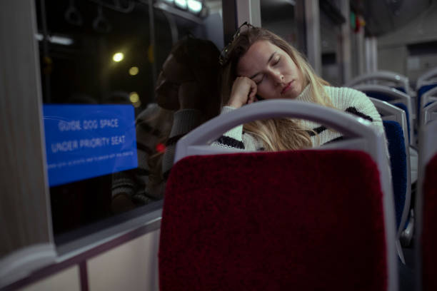 istock After the third shift, the woman returns home by bus. 1393041646