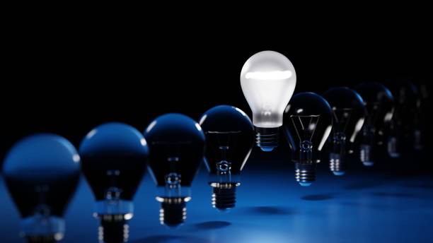 istock One being on light bulb in rows of darkened lamp, leader innovation concept, 3D rendering. 1393041782