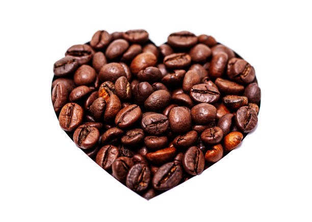 Coffee beans with heart shape isolated on white background