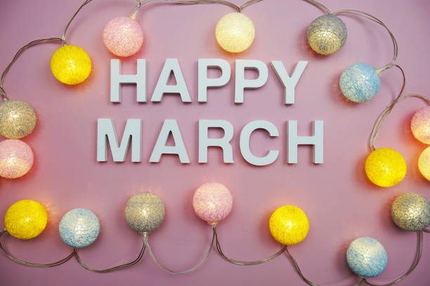 istock Happy March alphabet letters on pink background 1393058066