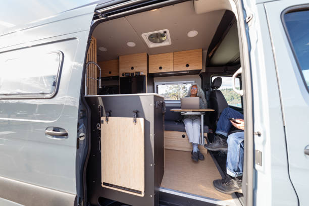 istock Senior woman relaxing in camper van 1393058325