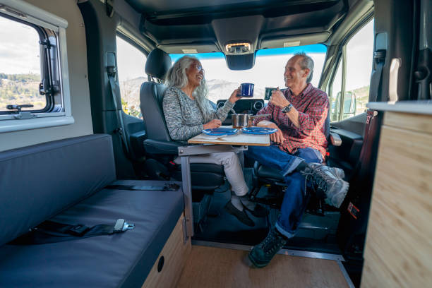 istock Vibrant senior couple eating breakfast in their camper van 1393058334