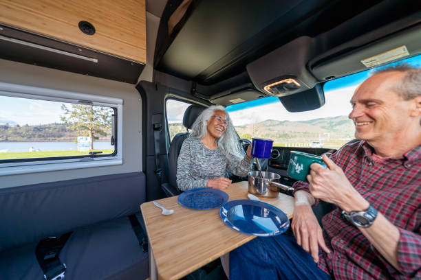 istock Vibrant senior couple eating breakfast in their camper van 1393058348