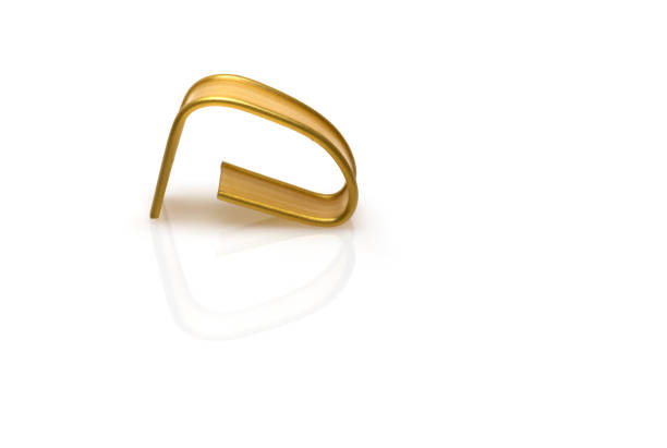 istock Closeup golden foil closure wire white background 1393058411