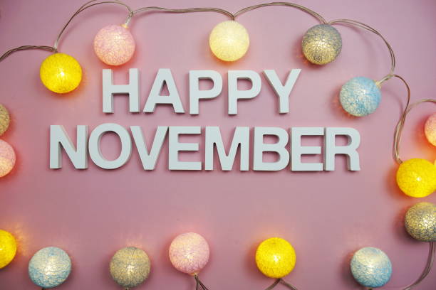 istock Happy November alphabet letters on pink background 1393059881