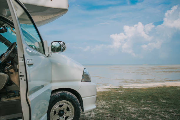 Motor home parked at beach during day