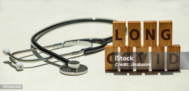 Stethoscope And Wooden Blocks With Wording Long Covid Stock Photo - Download Image Now